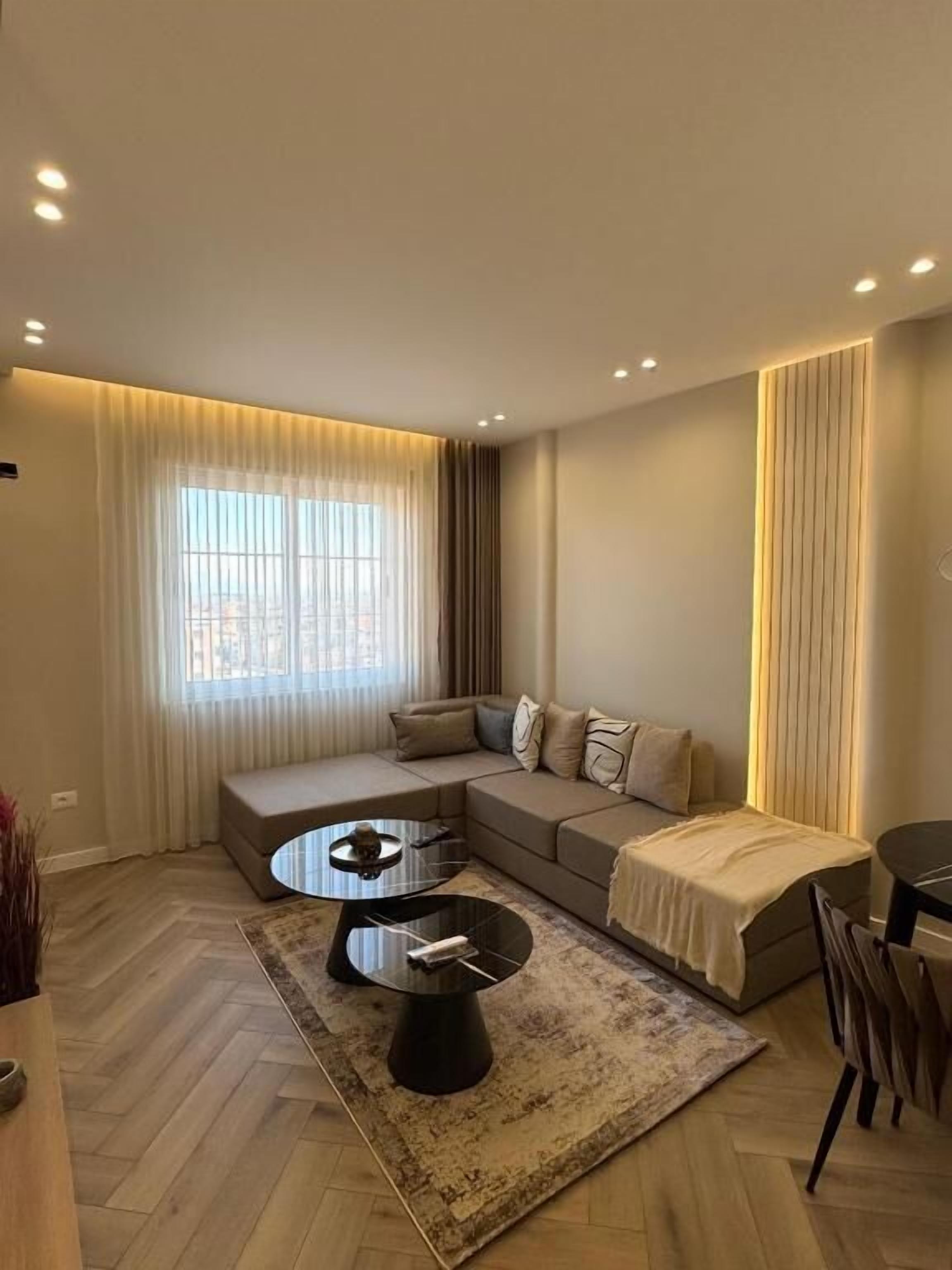 Deluxe Apartment, Balcony, City View | Living room | Flat-screen TV