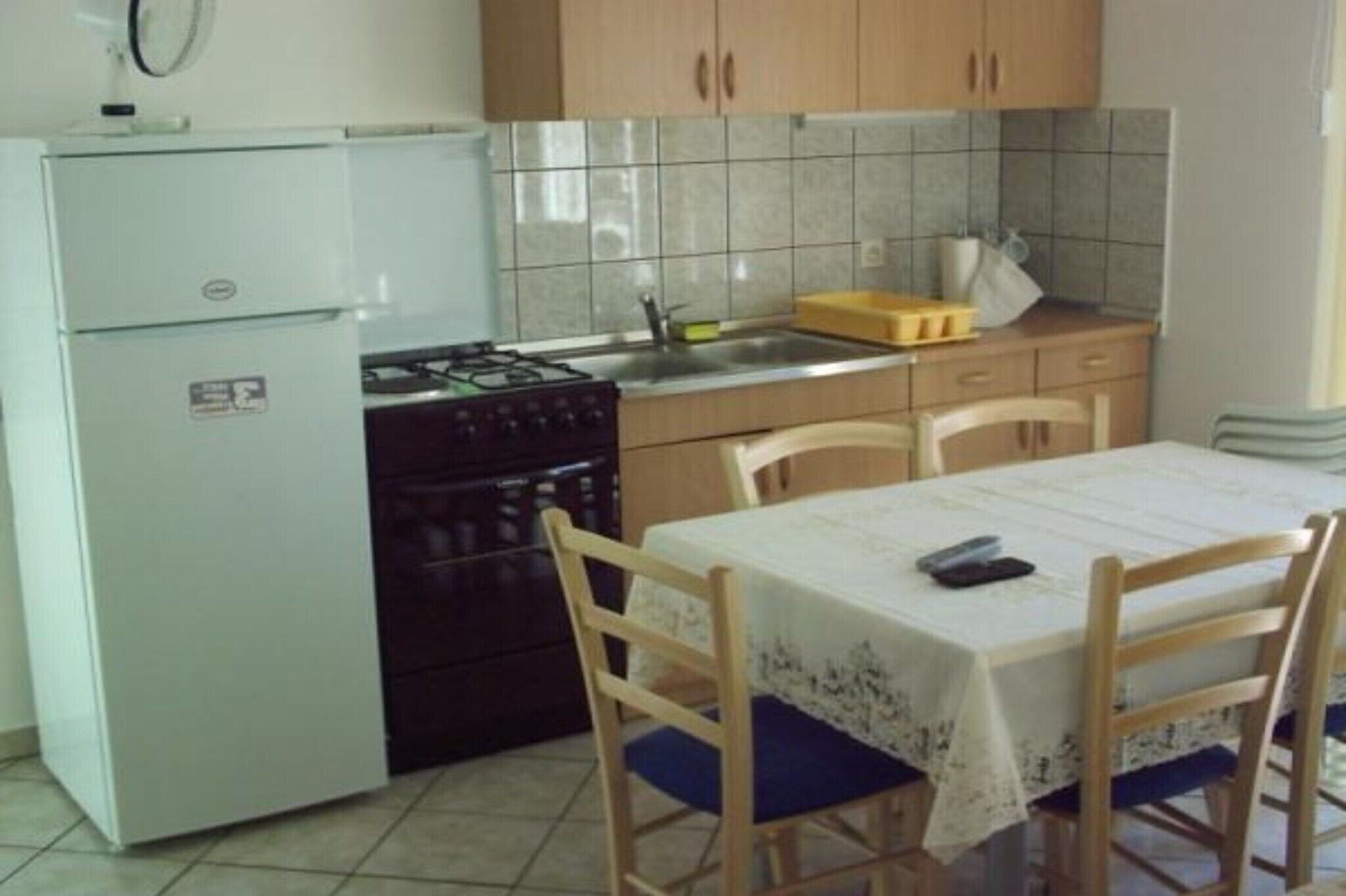 Fridge, oven, stovetop, dining tables