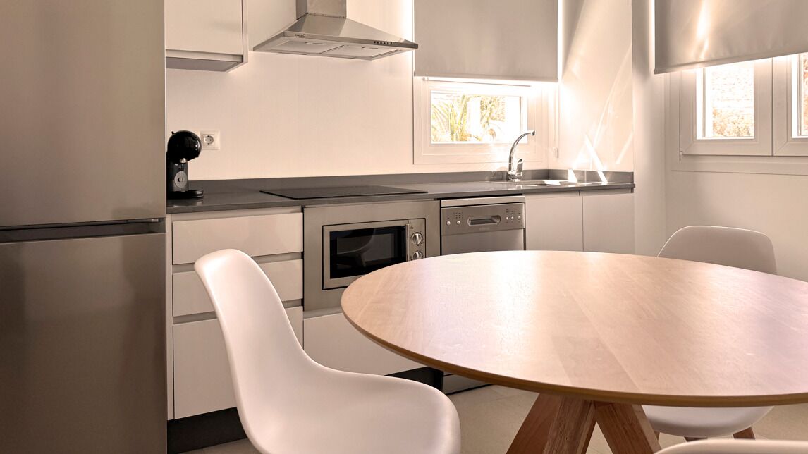 Deluxe Apartment, Pool View | Private kitchen | Fridge, microwave, stovetop, dishwasher