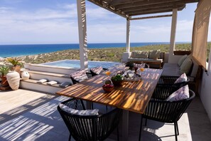 Outdoor dining - The Spacious Serenity Loft @ Seaside Villa w/Infinity Pool, Jacuzzi & Beach (Vinoramas Diamante)