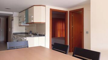 Apartment, 3 Bedrooms, Balcony, Pool View | Living area | 32-inch Smart TV with digital channels