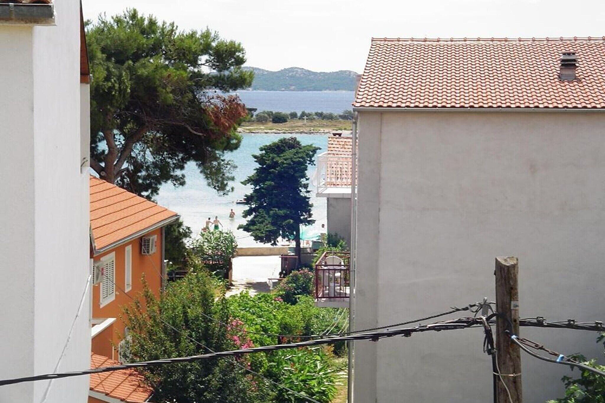 A coastal view with buildings and a clear sky.