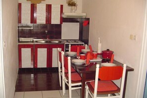 Fridge, oven, stovetop, dining tables