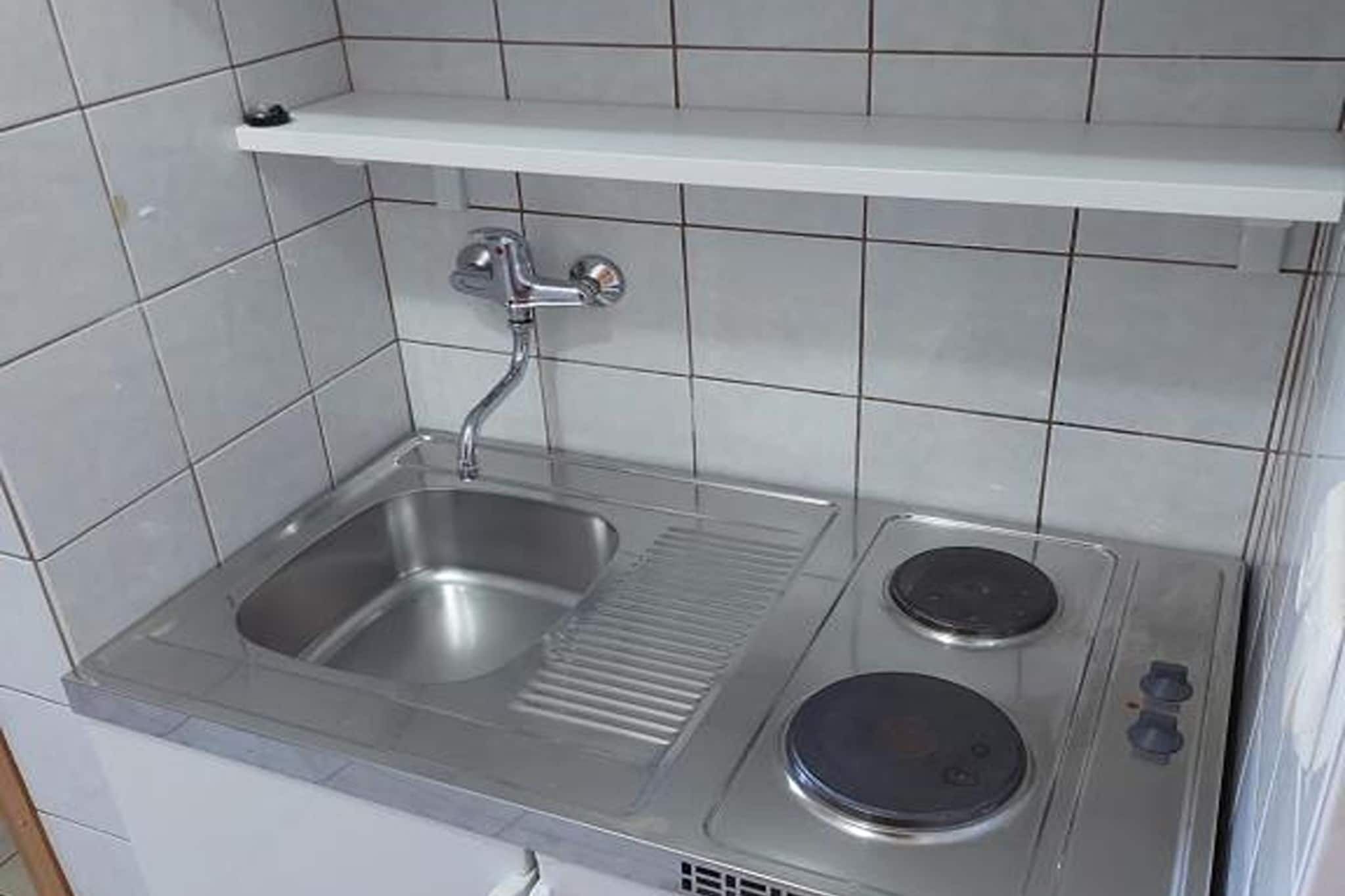 Fridge, stovetop, dining tables