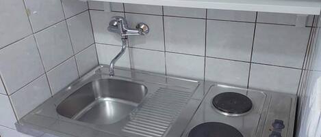 Fridge, stovetop, dining tables