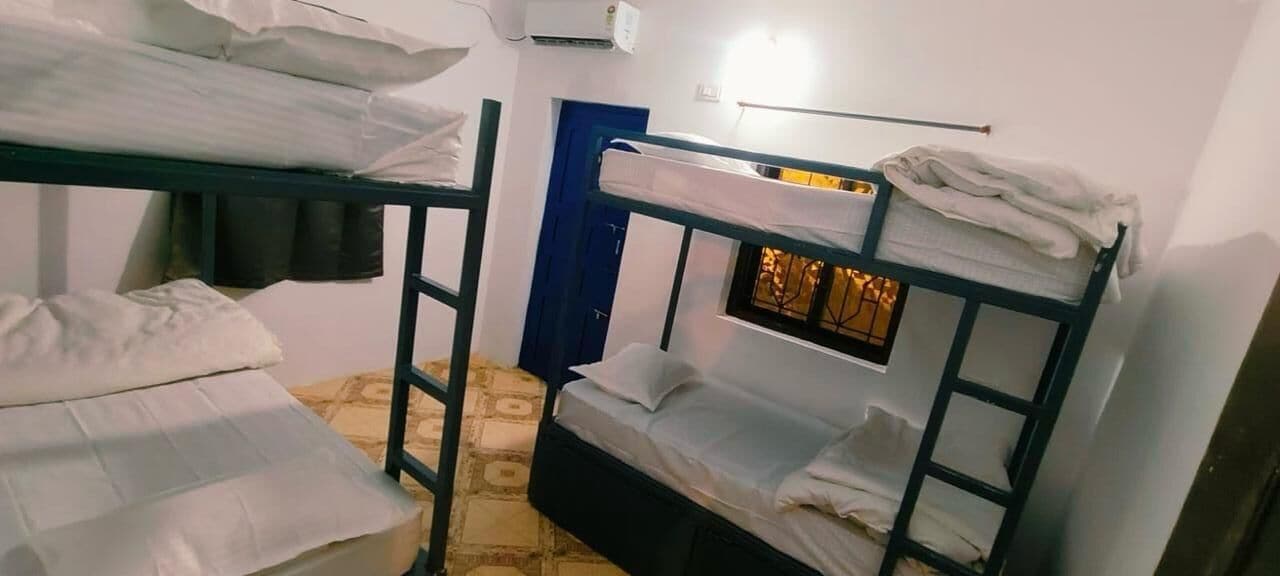 Economy Shared Dormitory | Laptop workspace, bed sheets