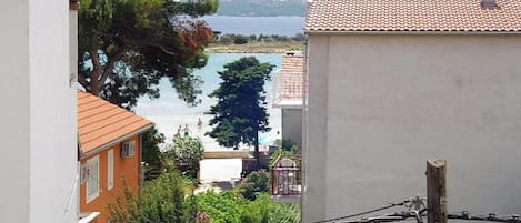 A coastal view with buildings and a clear sky.