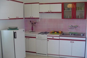 Fridge, stovetop, dining tables