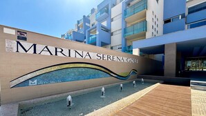 A modern building with the name "MARINA SERENA GOLF" prominently displayed. - Apartment in Poblado Golf near Playa Serena (Roquetas de Mar)