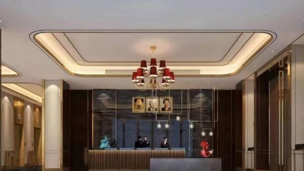 A modern hotel lobby with a reception desk, a chandelier, and framed pictures on the wall. - Meihao Hotel (Sihanoukville)