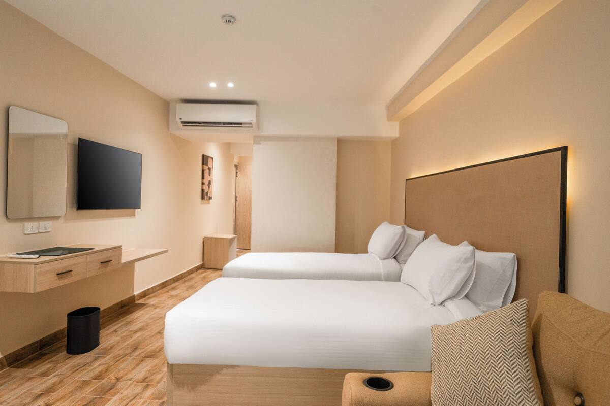 Deluxe Double Room, City View | In-room safe, blackout drapes, iron/ironing board, free WiFi