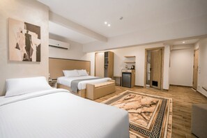 Family Room, City View | In-room safe, blackout drapes, iron/ironing board, free WiFi