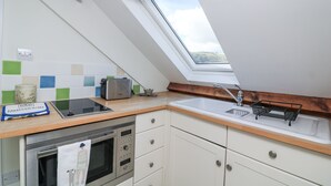 A kitchen with a skylight, a microwave, a toaster, and a sink. - Fastnet at Nonsuch House (Dartmouth)