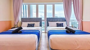 A hotel room with two beds, a large window, and curtains. - Medini Signature Suites by RR JBcity (Iskandar Puteri)