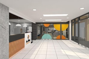 A modern lobby with a reception desk, a glass wall, and a tiled floor. - The City Flats Circuit Makati (Makati)