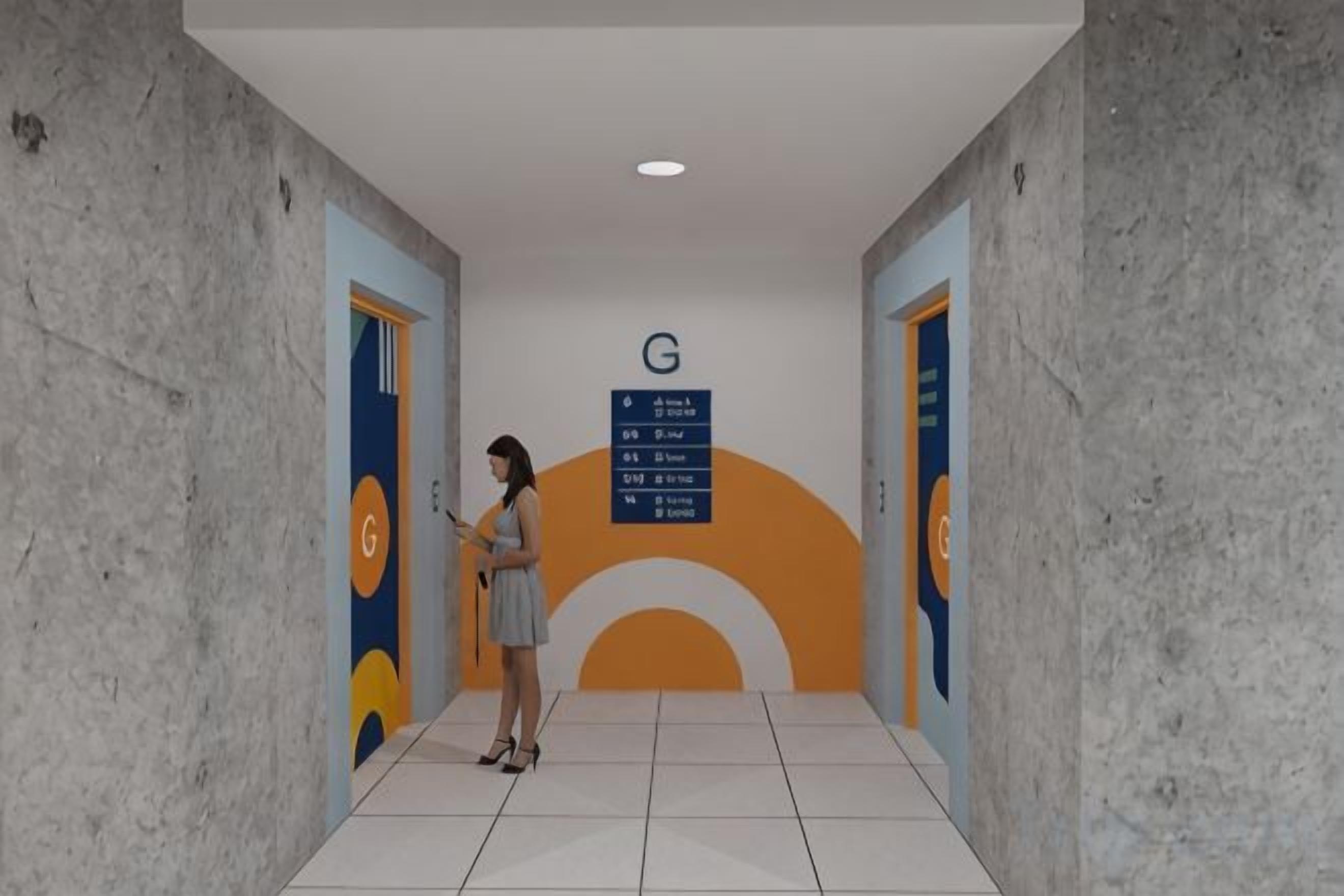 Corredor com uma pessoa em pé, uma placa com a letra 'G' e um painel de parede com um desenho circular.