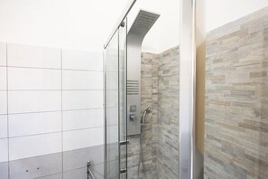 Shower, towels, shampoo, toilet paper