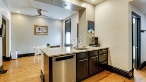A modern kitchen with a dishwasher, sink, and a coffee maker. - Walk to Tower Grove Park: St Louis Getaway (St. Louis)
