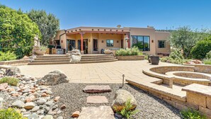 A modern house with a patio, stone steps, and a garden with rocks and plants. - 1/2 Mi to Airport Mesa! Hot Tub Haven w/ Mtn Views (Sedona)