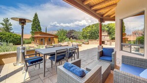An outdoor patio with a table and chairs, a wicker sofa, and a pergola. - 1/2 Mi to Airport Mesa! Hot Tub Haven w/ Mtn Views (Sedona)