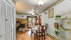 A dining area with a round table, chairs, and a ceiling fan. - Mine for Gems & Chase Waterfalls: Franklin Retreat (Franklin)