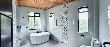 Executive Apartment, Garden View | Bathroom | Shower, slippers, towels, soap