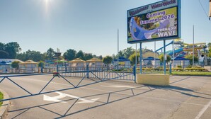 A water park entrance with a sign advertising a tornado wave attraction coming in summer 2026. - 'wishin & Fishin' Walkable Erie Home By the Beach! (Erie)