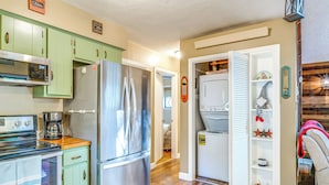 A compact kitchen with a refrigerator, stove, and microwave. - Featured on Hgtv! Visit This Lottery Dream Home! (Pocono Lake)