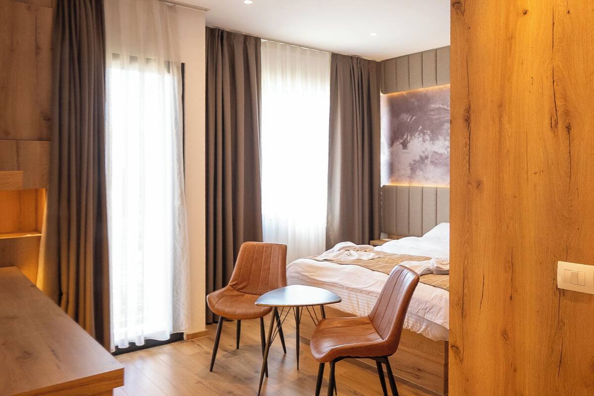 Deluxe Suite, Balcony | In-room safe, desk, laptop workspace, soundproofing