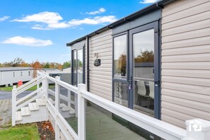 Exterior detail - swimming pool, entertainment complex, and children's play areas. (Longniddry)