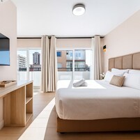 Studio, Balcony, City View | In-room safe, desk, blackout drapes, iron/ironing board