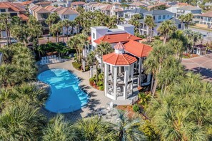 A resort with a swimming pool, palm trees, and a gazebo. - Completely Remodeled and All New Furnishings! (Destin)