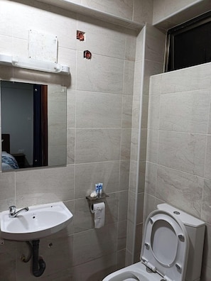 Deluxe Double Room, City View | Bathroom | Shower, slippers, towels, soap