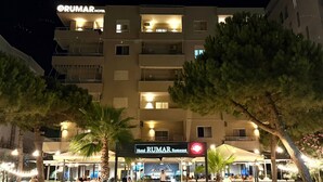A hotel with a sign reading "Hotel RUMAR Restaurant" and a well-lit entrance. - Rumar Hotel (Durres)