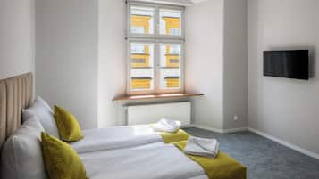Deluxe Quadruple Room, City View | Iron/ironing board, free WiFi, bed sheets