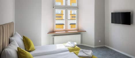 Deluxe Quadruple Room, City View | Iron/ironing board, free WiFi, bed sheets