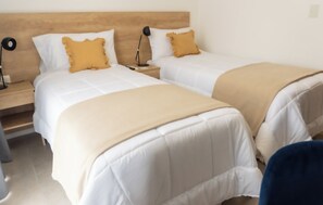 Desk, laptop workspace, free WiFi, bed sheets