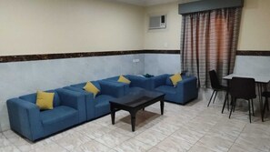 Suite Deluxe, 1 chambre | Coin séjour