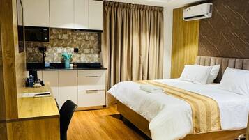 1 غرفة نوم ومكواة/لوح كي وواي فاي وملاءات أسرّة