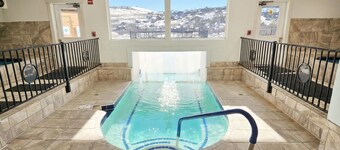 Cozy 2-bed, 2-bath mountain condo with ski-in/ski-out access, sweeping views, and indoor pool + hot tub. Fully stocked kitchen, fireplace, private balcony, and thoughtful amenities make this the perfect year-round retreat in Granby Ranch.