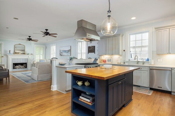 Fridge, dishwasher, coffee/tea maker, cookware/dishes/utensils