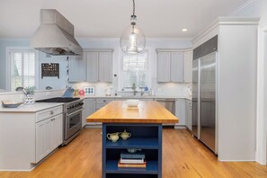 Fridge, dishwasher, coffee/tea maker, cookware/dishes/utensils