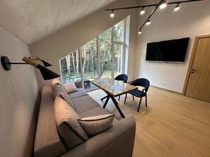 Comfort Apartment, Garden View | Living area