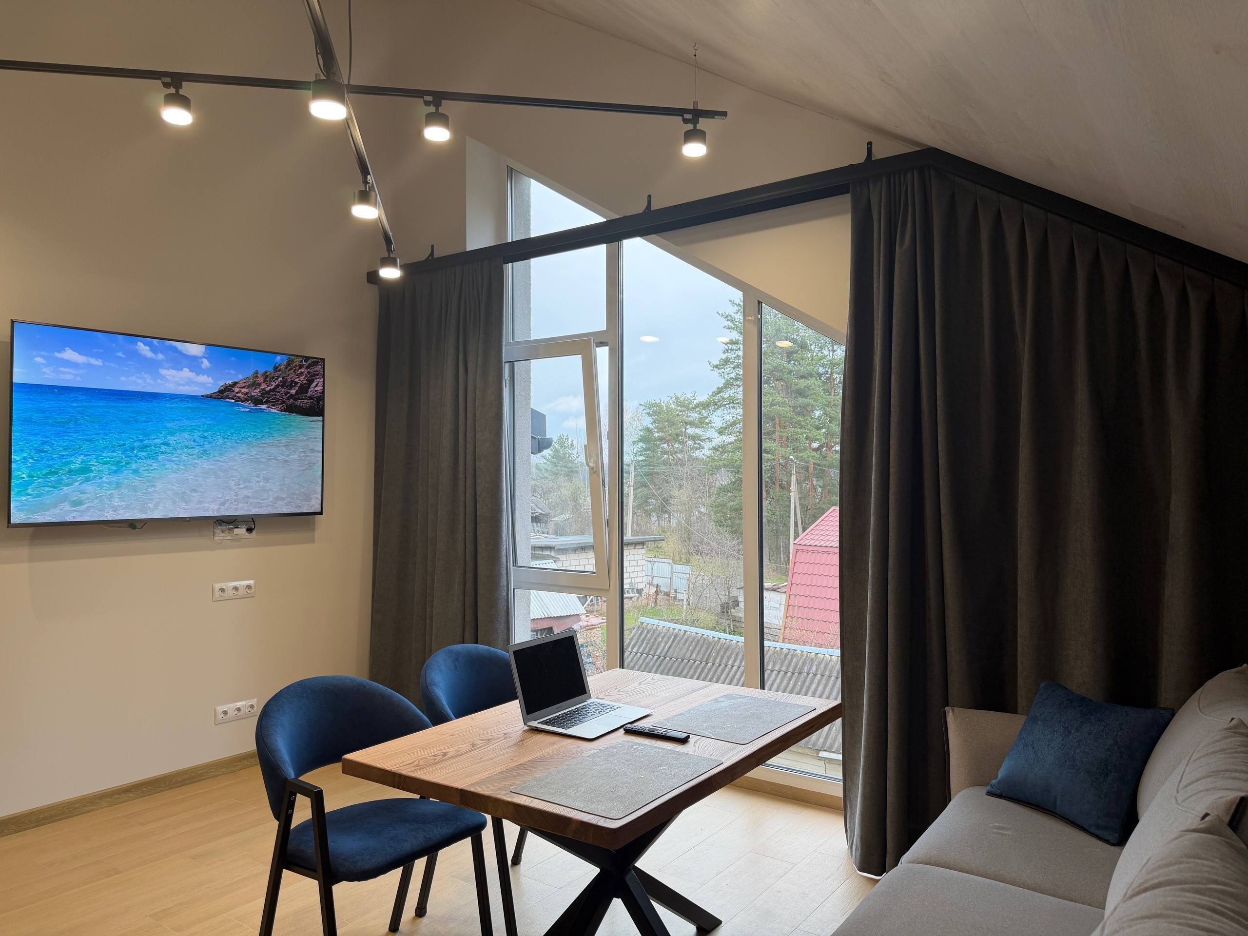 Superior Apartment | Living area | 40-inch Smart TV with digital channels