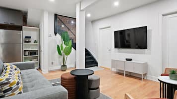 Classic Apartment, 3 Bedrooms | Living area | Flat-screen TV