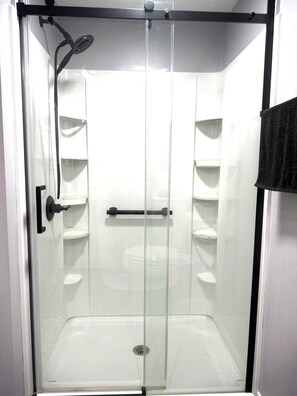 Shower, hair dryer, towels, soap