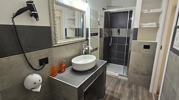 Quadruple Room, Multiple Beds, Patio, Courtyard View | Bathroom | Shower, hair dryer, towels, soap