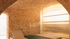 An arched brick room with a pool table, lounge chairs, and a large window. - HOCHPARTERRE WEST: wood-burning stove, west-facing balcony and kitchen island (Werben)