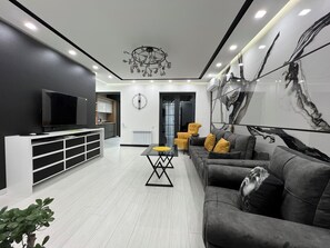 Deluxe Apartment, 2 Bedrooms | Living area | 50-inch flat-screen TV with cable channels - Apartment by Luxe Group ZA444 (Yerevan)