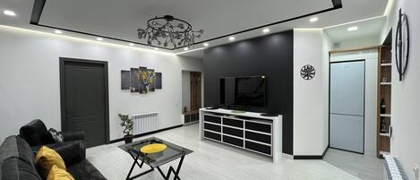 Apartamento Deluxe, 2 habitaciones | Zona de estar